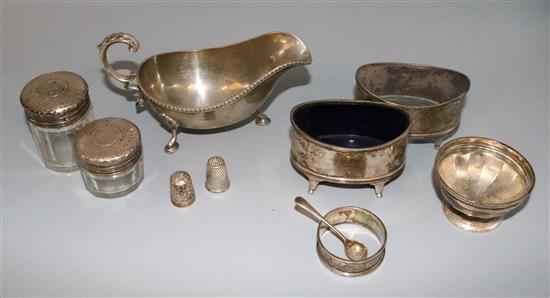 Silver sauceboat, pair silver salts ( 1 lacking glass liner), small silver bowl, thimble, napkin ring, 2 silver lidded toilet jars